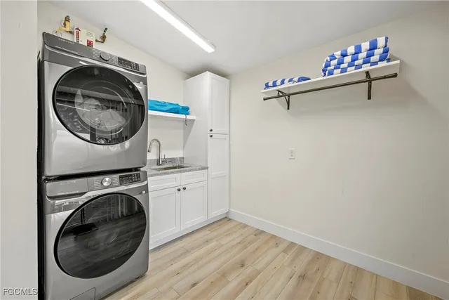 a view of a hallway with washer and dryer