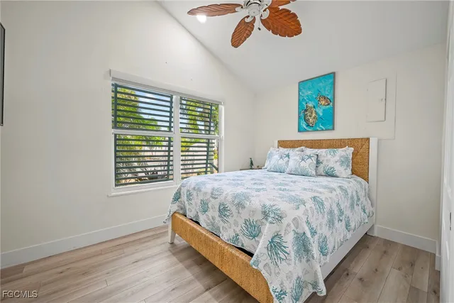 a large bed sitting in a bedroom next to a window