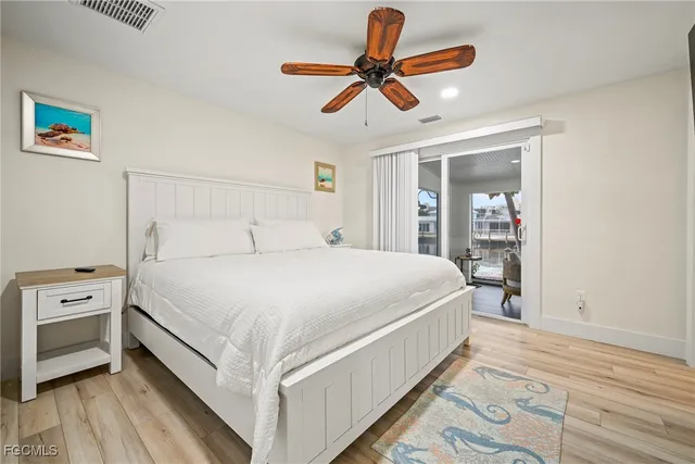 a large white bed in a white room