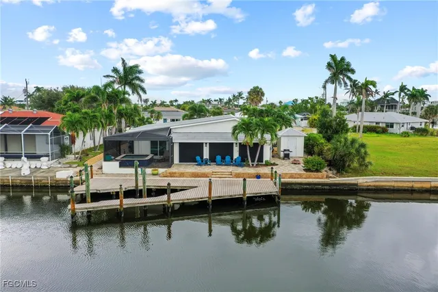 a view of house with swimming pool outdoor seating area and barbeque oven