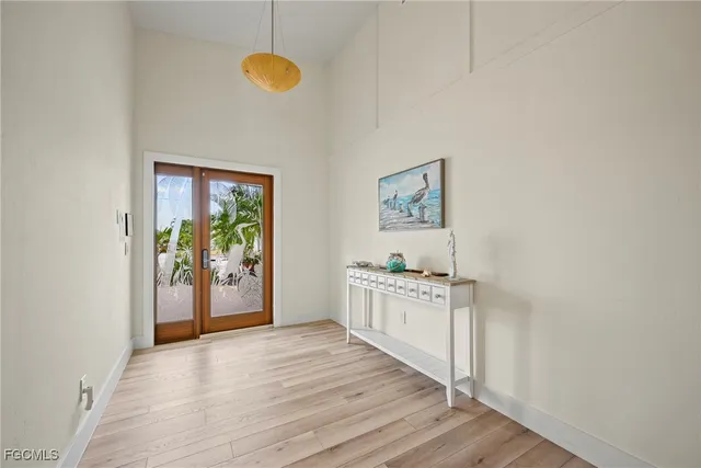 a kitchen with stainless steel appliances granite countertop a stove a refrigerator a sink a with dishwasher and wooden floor