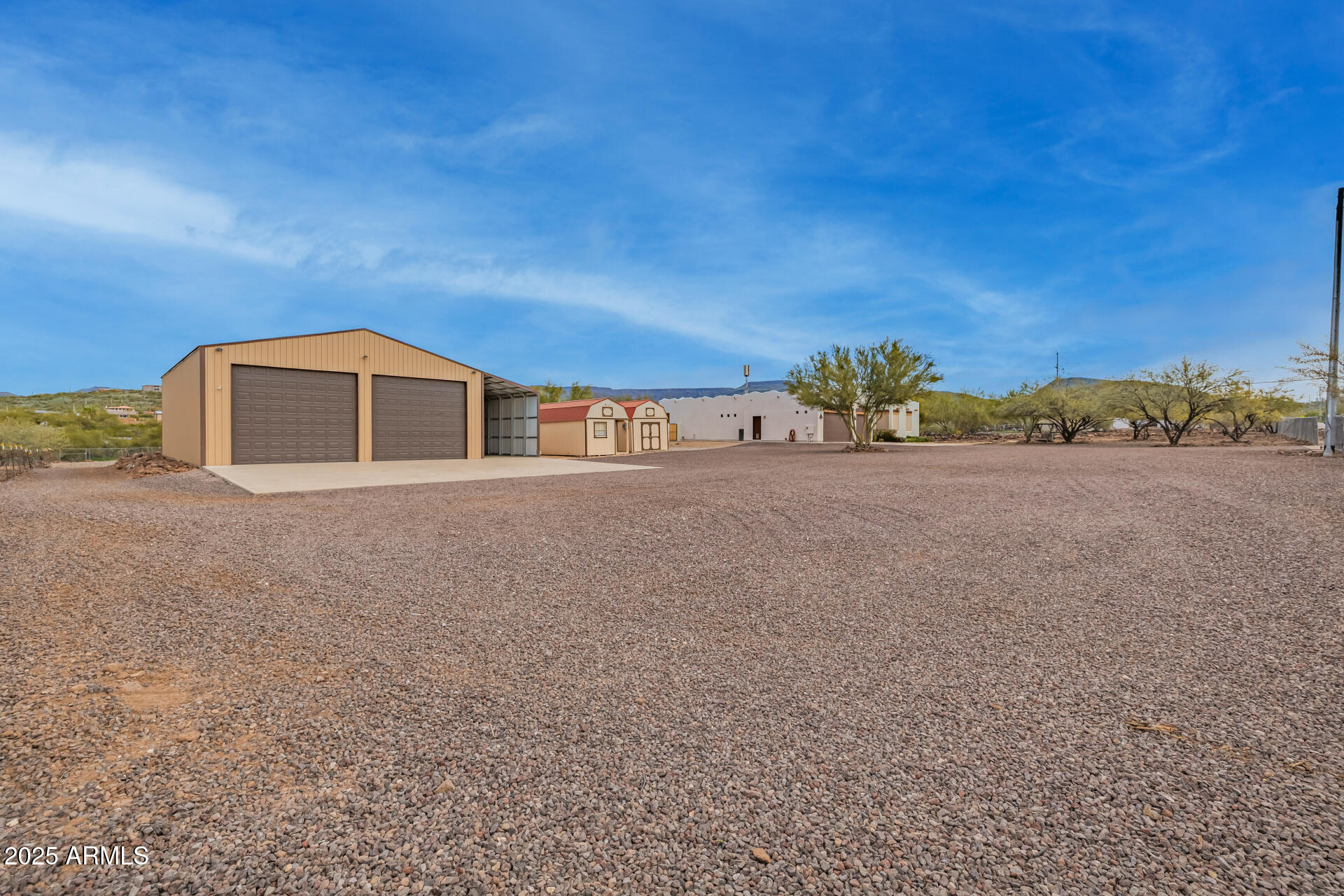 1540 East Circle Mountain Road New River, AZ 85087 - Photo 20 of 65 a front view of a house with a yard