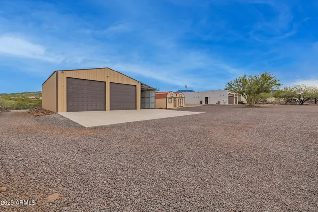 a view of storage and utility room with wooden floor