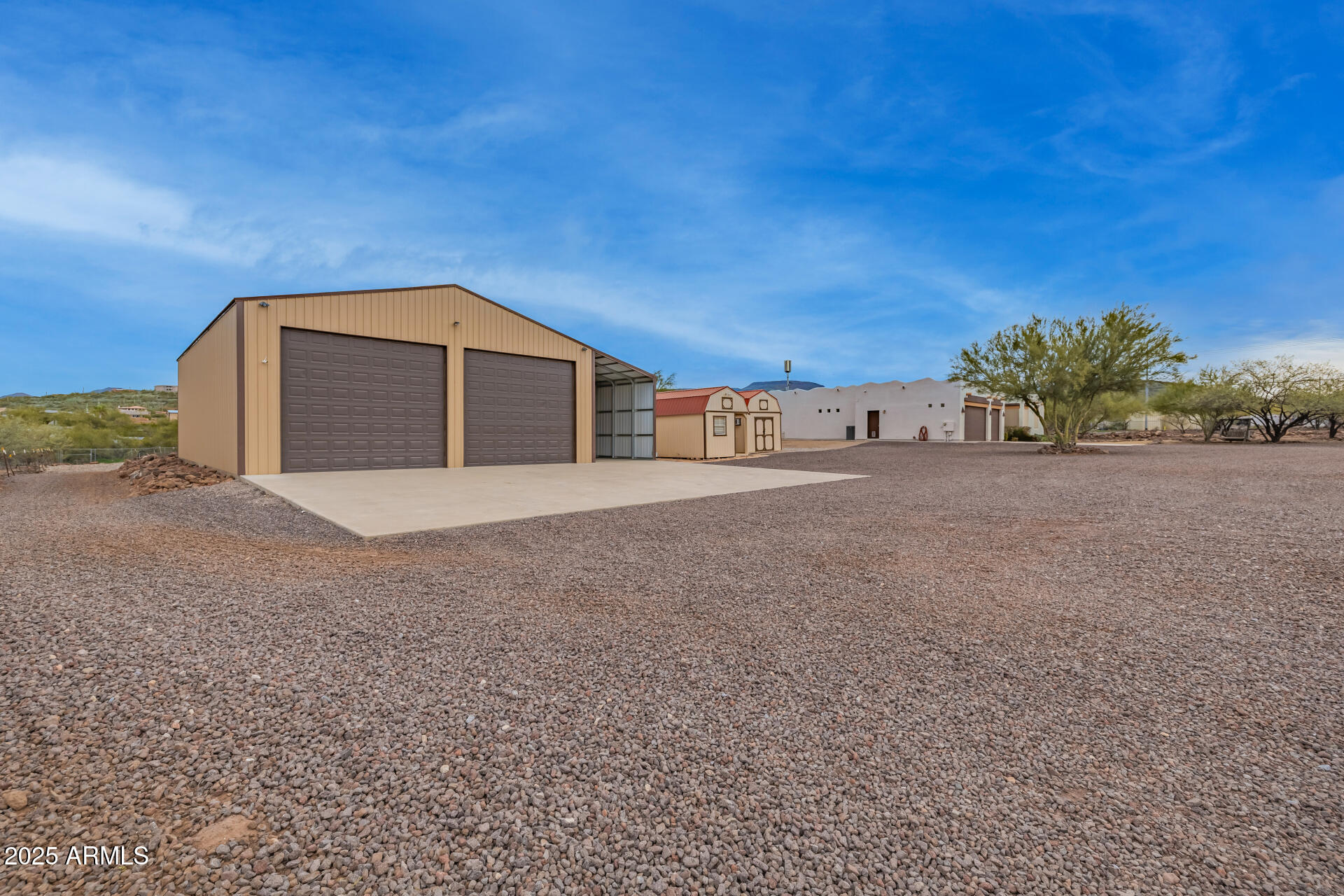 1540 East Circle Mountain Road New River, AZ 85087 - Photo 22 of 65 a front view of a house with a yard