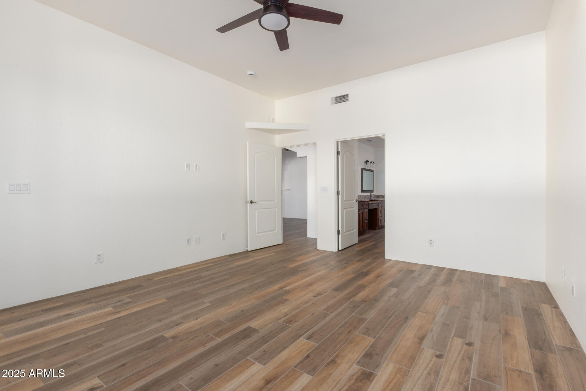 1540 East Circle Mountain Road New River, AZ 85087 - Photo 38 of 65 wooden floor in an empty room