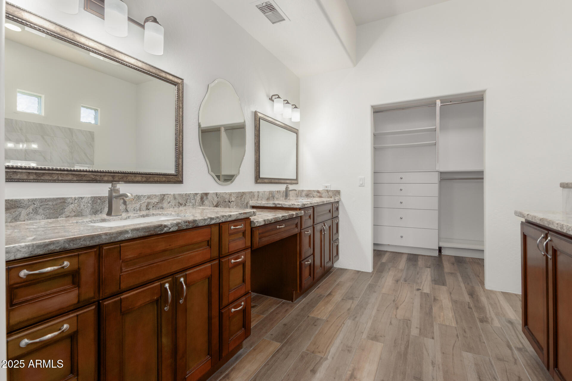1540 East Circle Mountain Road New River, AZ 85087 - Photo 39 of 65 a spacious bathroom with a granite countertop sink mirror and a toilet