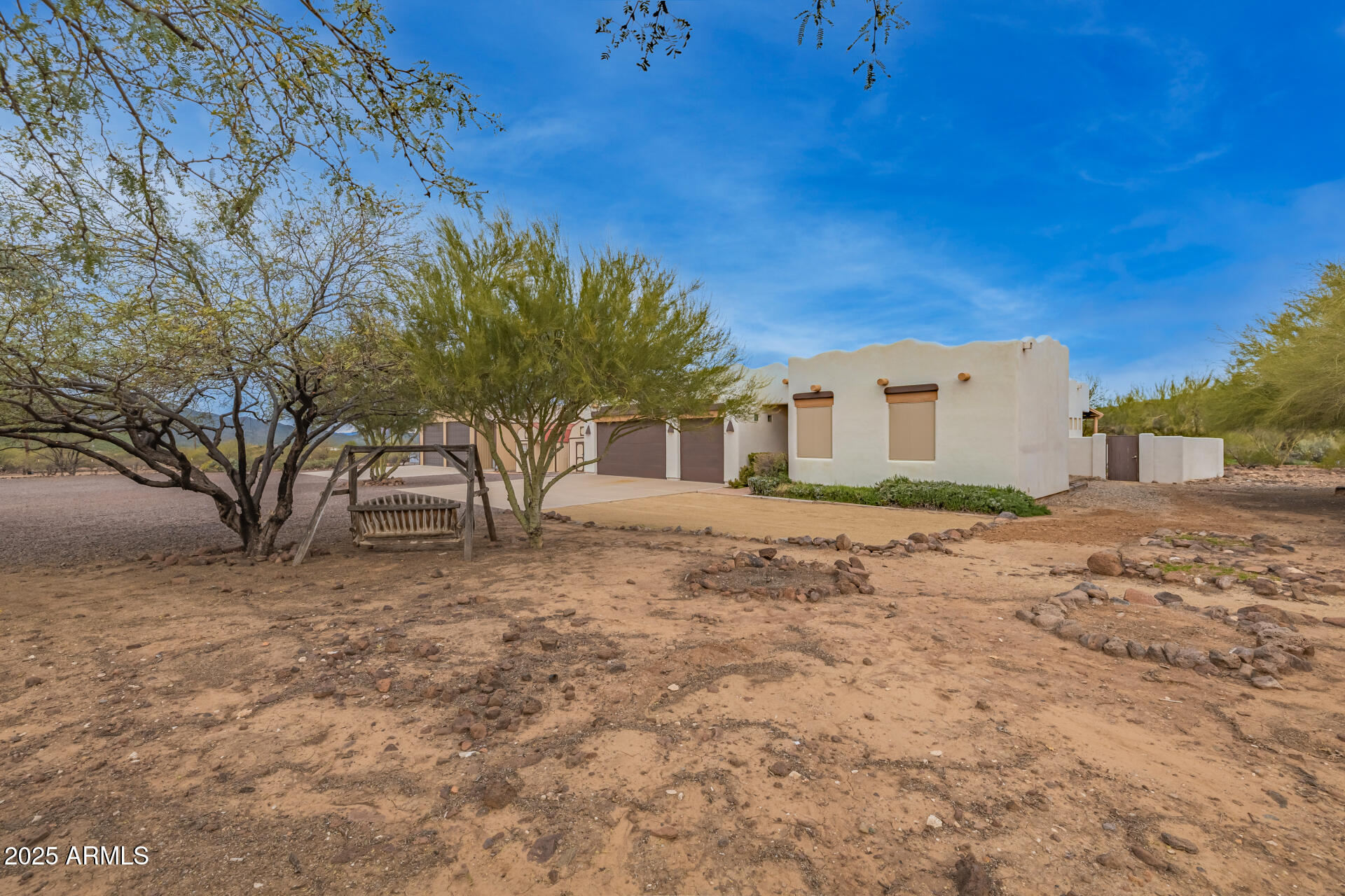 1540 East Circle Mountain Road New River, AZ 85087 - Photo 4 of 65 a front view of a house with a yard