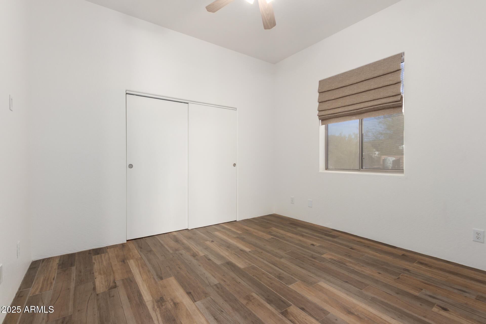 1540 East Circle Mountain Road New River, AZ 85087 - Photo 44 of 65 an empty room with a window