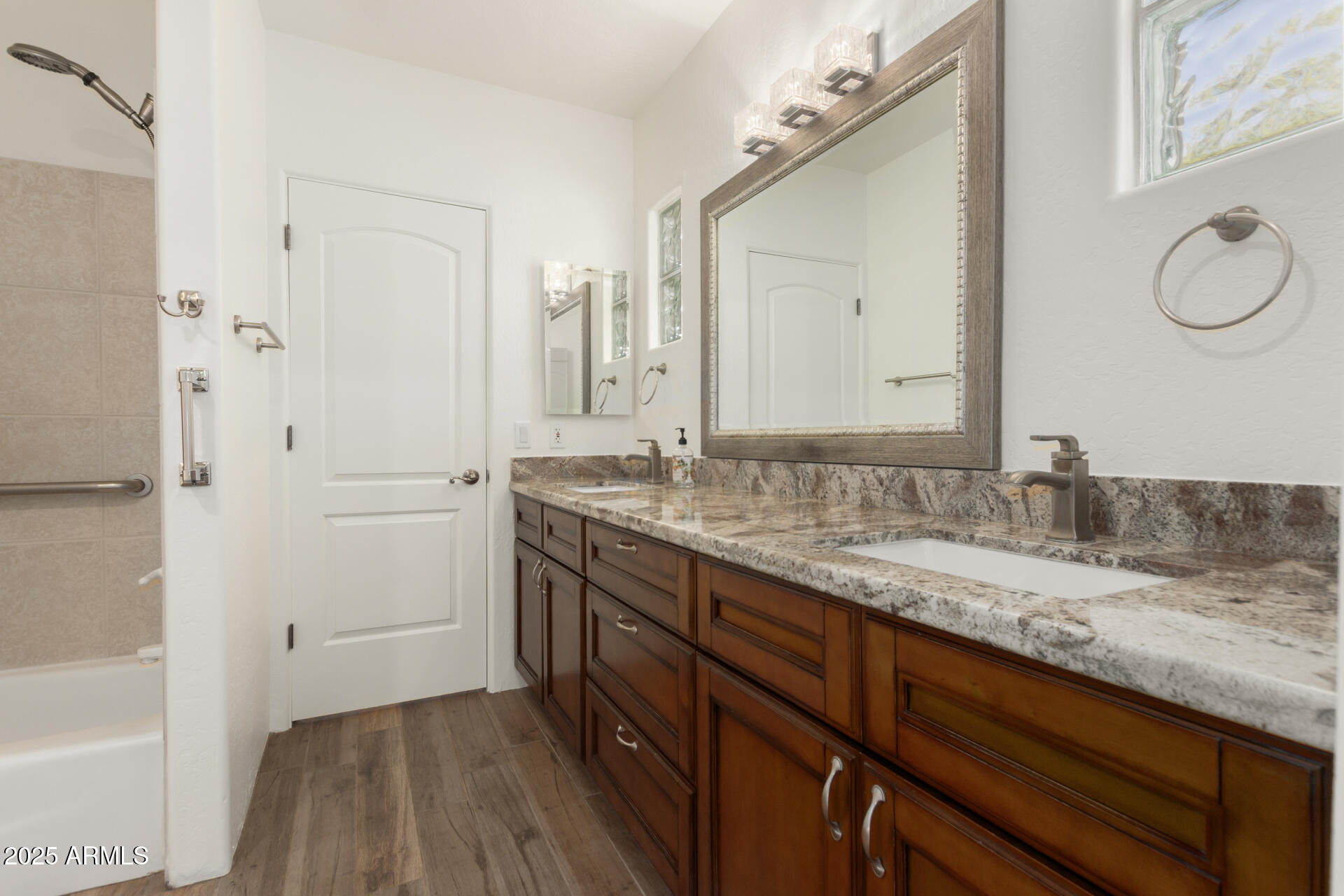1540 East Circle Mountain Road New River, AZ 85087 - Photo 46 of 65 a bathroom with a granite countertop sink mirror and double