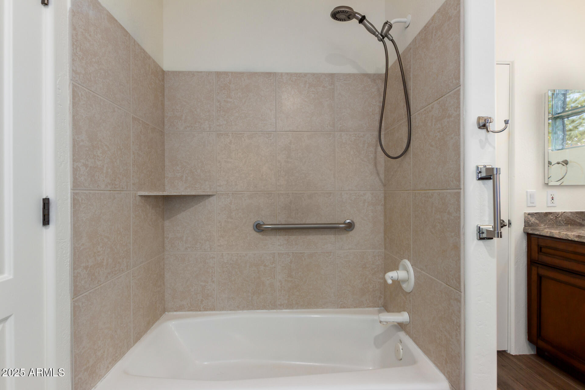 1540 East Circle Mountain Road New River, AZ 85087 - Photo 47 of 65 a bathroom with a bath tub and a shower