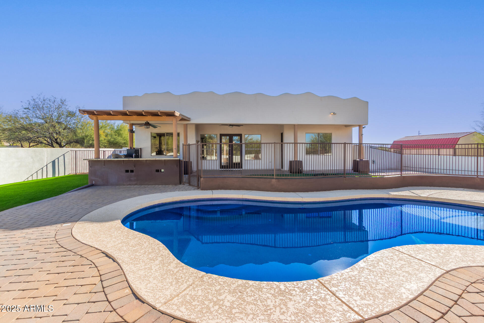 1540 East Circle Mountain Road New River, AZ 85087 - Photo 56 of 65 a view of a house with a swimming pool