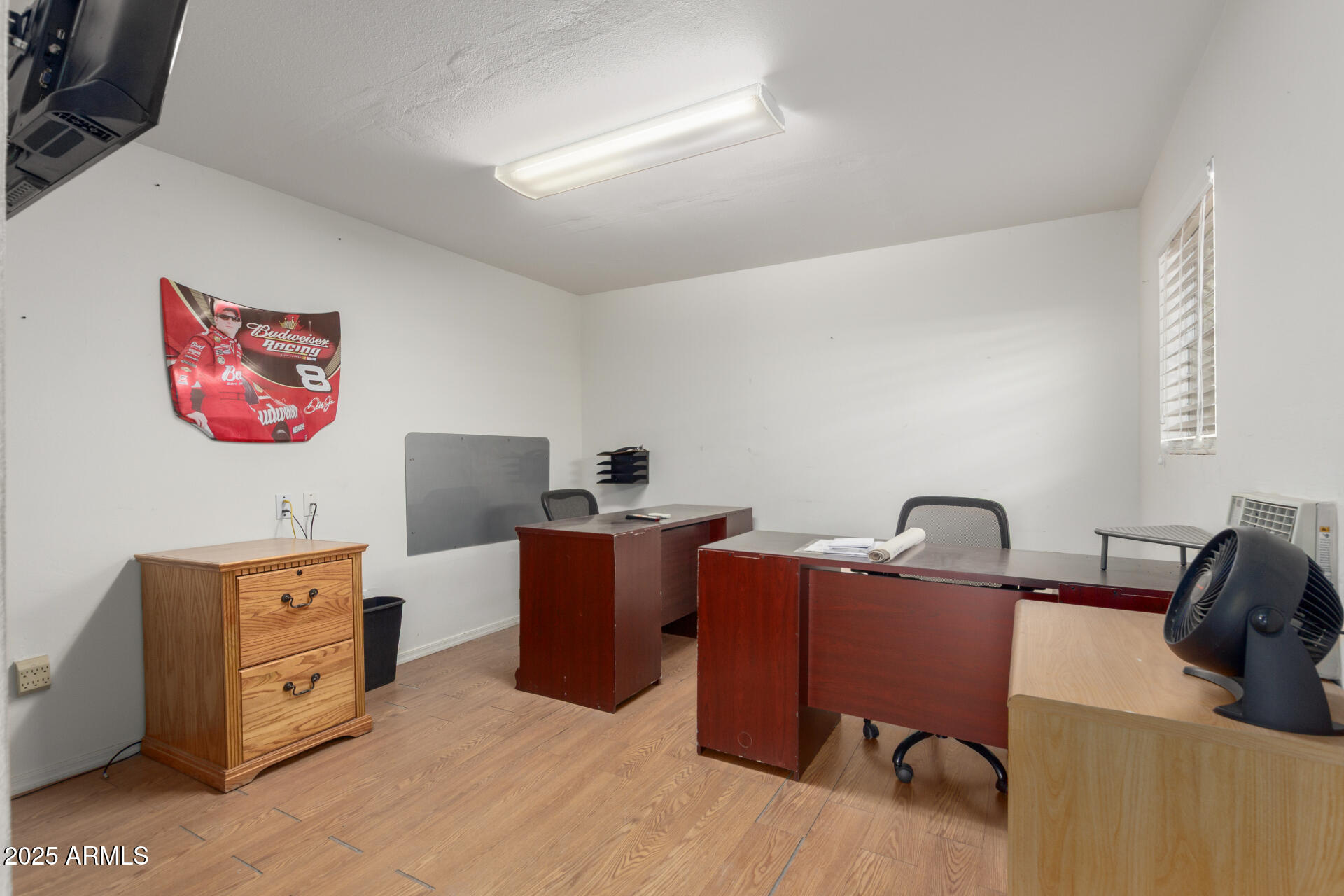 1540 East Circle Mountain Road New River, AZ 85087 - Photo 61 of 65 a view of a workspace with furniture and a flat screen tv