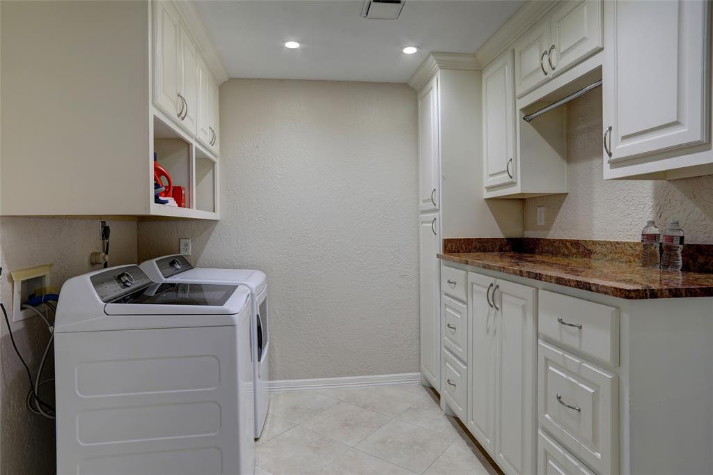 2905 Wyndham Lane Richardson, TX 75082 - Photo 24 of 27 a kitchen with granite countertop a sink stove and cabinets
