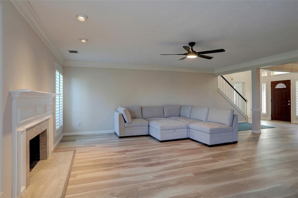 2905 Wyndham Lane Richardson, TX 75082 - Photo 5 of 27 a living room with furniture and a fireplace