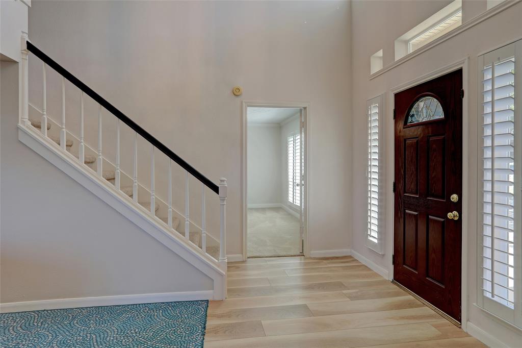 2905 Wyndham Lane Richardson, TX 75082 - Photo 8 of 27 a view of entryway and hall with wooden floor