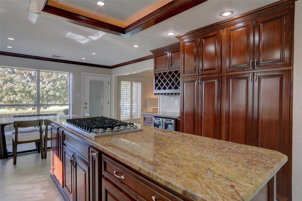 2905 Wyndham Lane Richardson, TX 75082 - Photo 10 of 27 a kitchen with stainless steel appliances granite countertop a stove a sink and a refrigerator