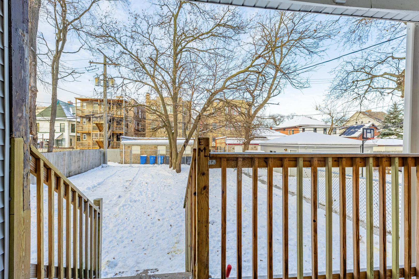 2038 East 73rd Street Chicago, IL 60649 - Photo 28 of 28 a view of a balcony with wooden fence