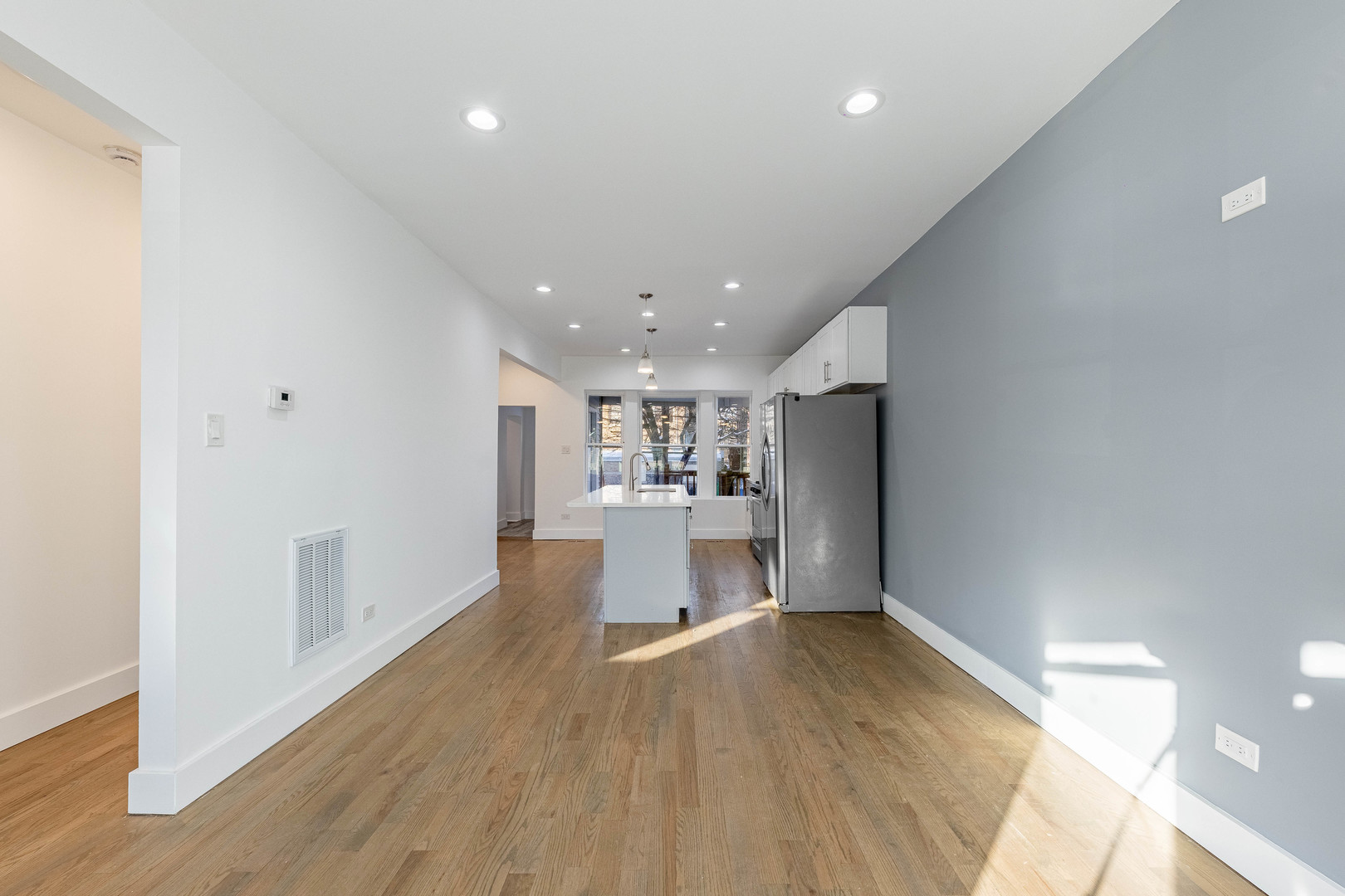 2038 East 73rd Street Chicago, IL 60649 - Photo 5 of 28 a view of a living room and wooden floor
