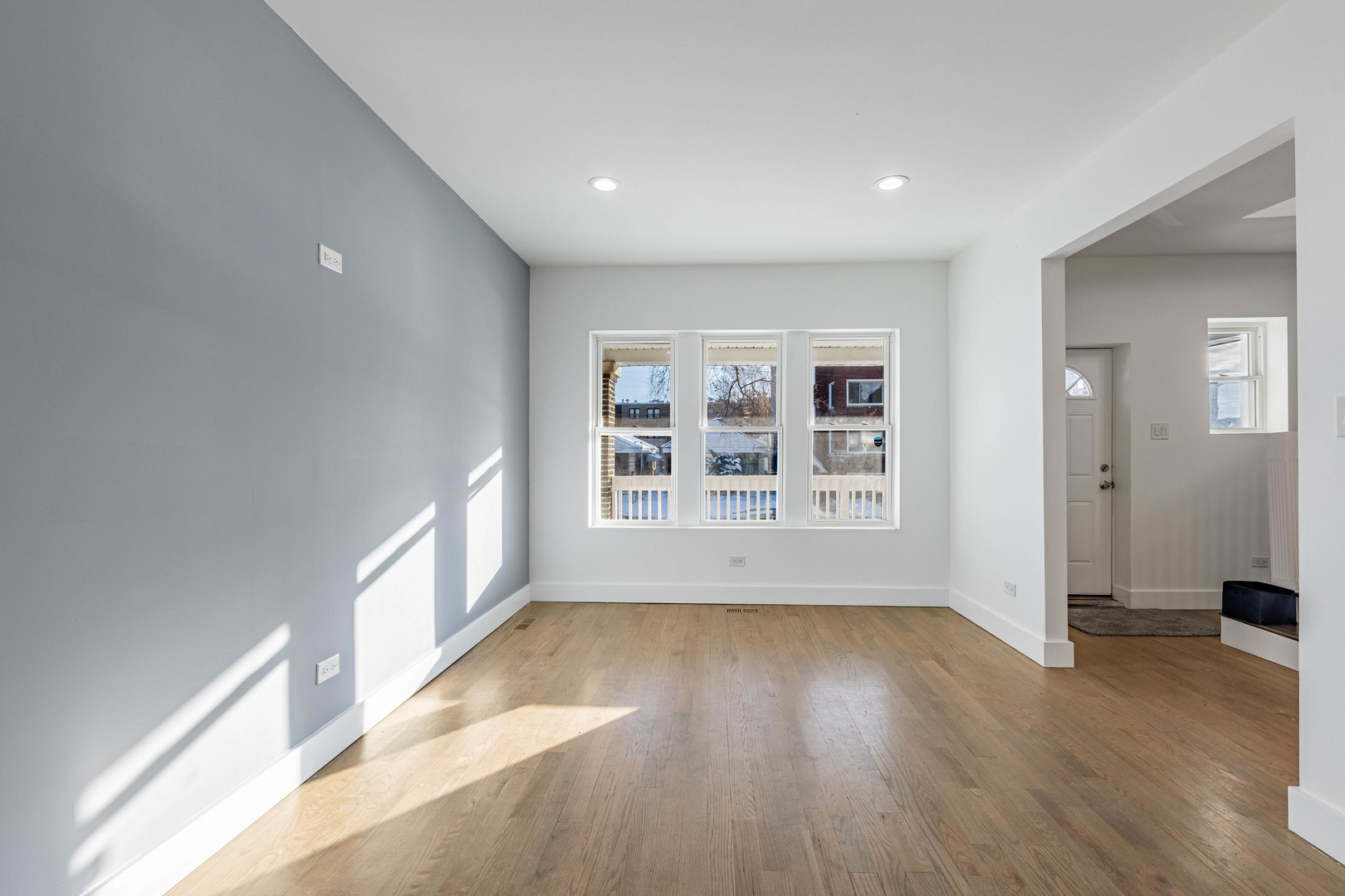 2038 East 73rd Street Chicago, IL 60649 - Photo 6 of 28 wooden floor in an empty room with a window