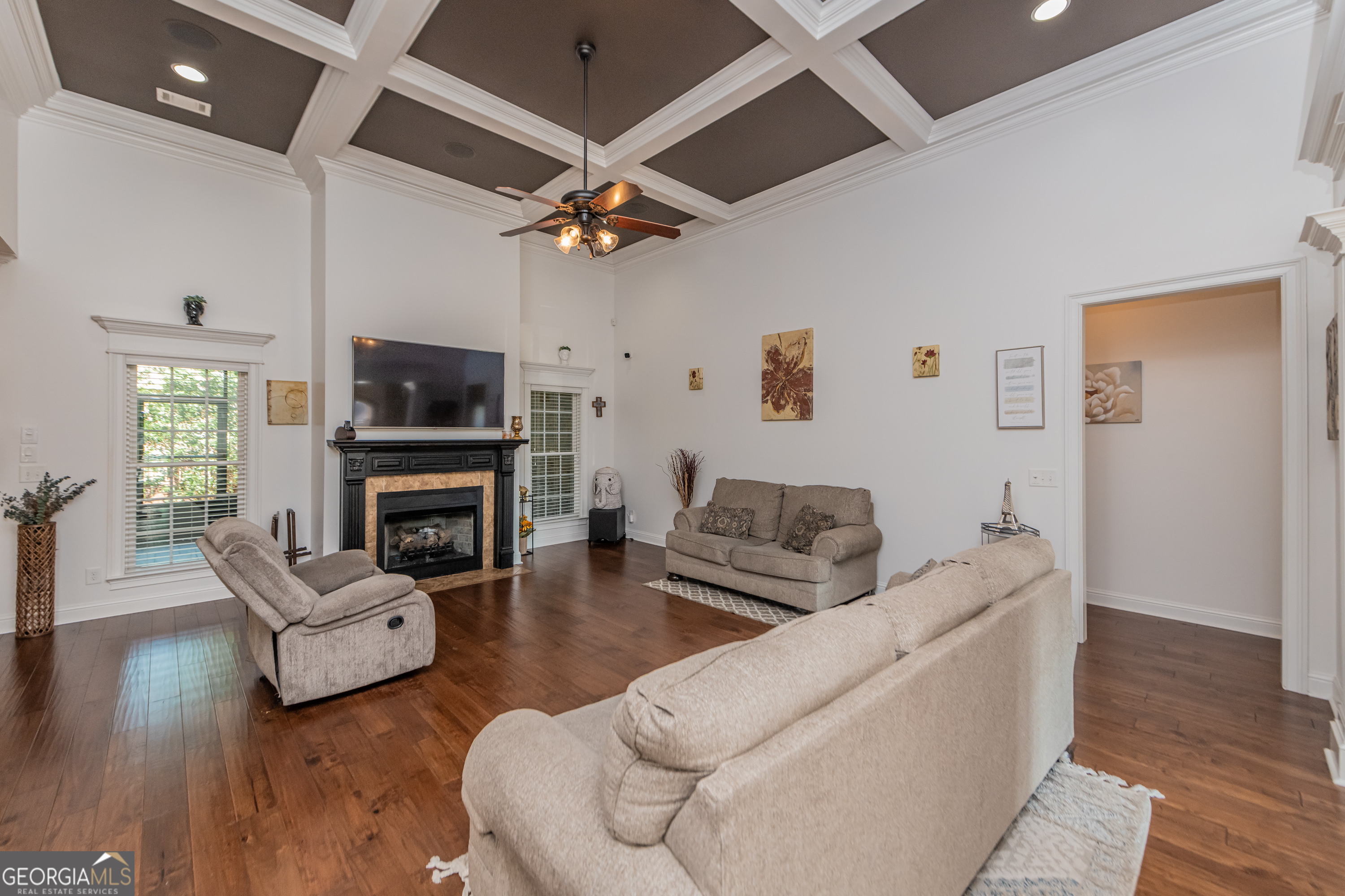 405 Old Bridge Road Warner Robins, GA 31088 - Photo 9 of 55 a living room with furniture a fireplace and a flat screen tv