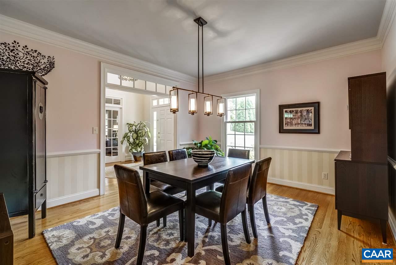 3465 Darby Road Keswick, VA 22947 - Photo 11 of 48 a dining room with furniture a chandelier and wooden floor