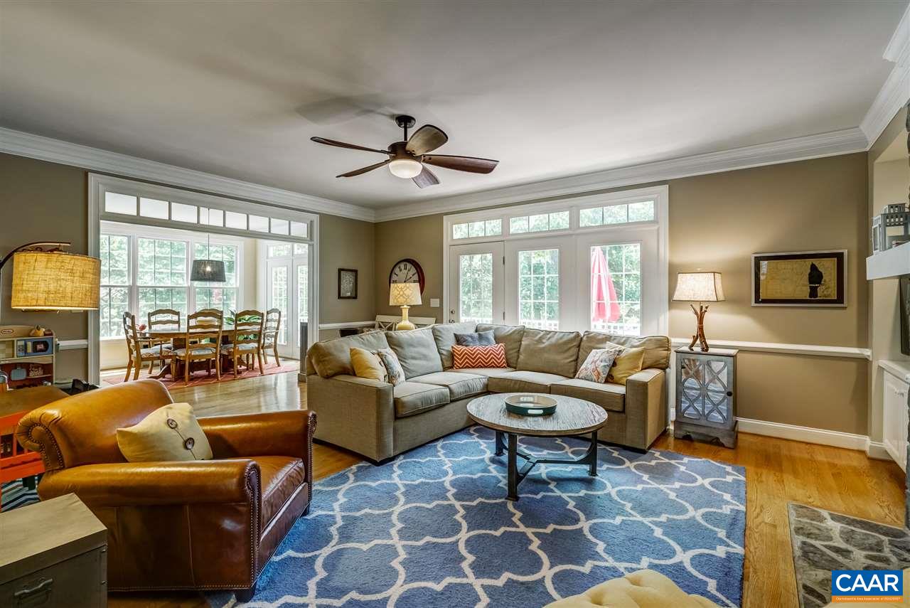 3465 Darby Road Keswick, VA 22947 - Photo 14 of 48 a living room with furniture a large window and a rug