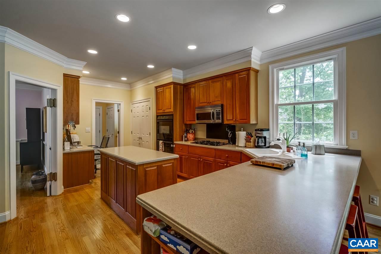 3465 Darby Road Keswick, VA 22947 - Photo 18 of 48 a kitchen with stainless steel appliances a stove a sink a refrigerator and cabinets