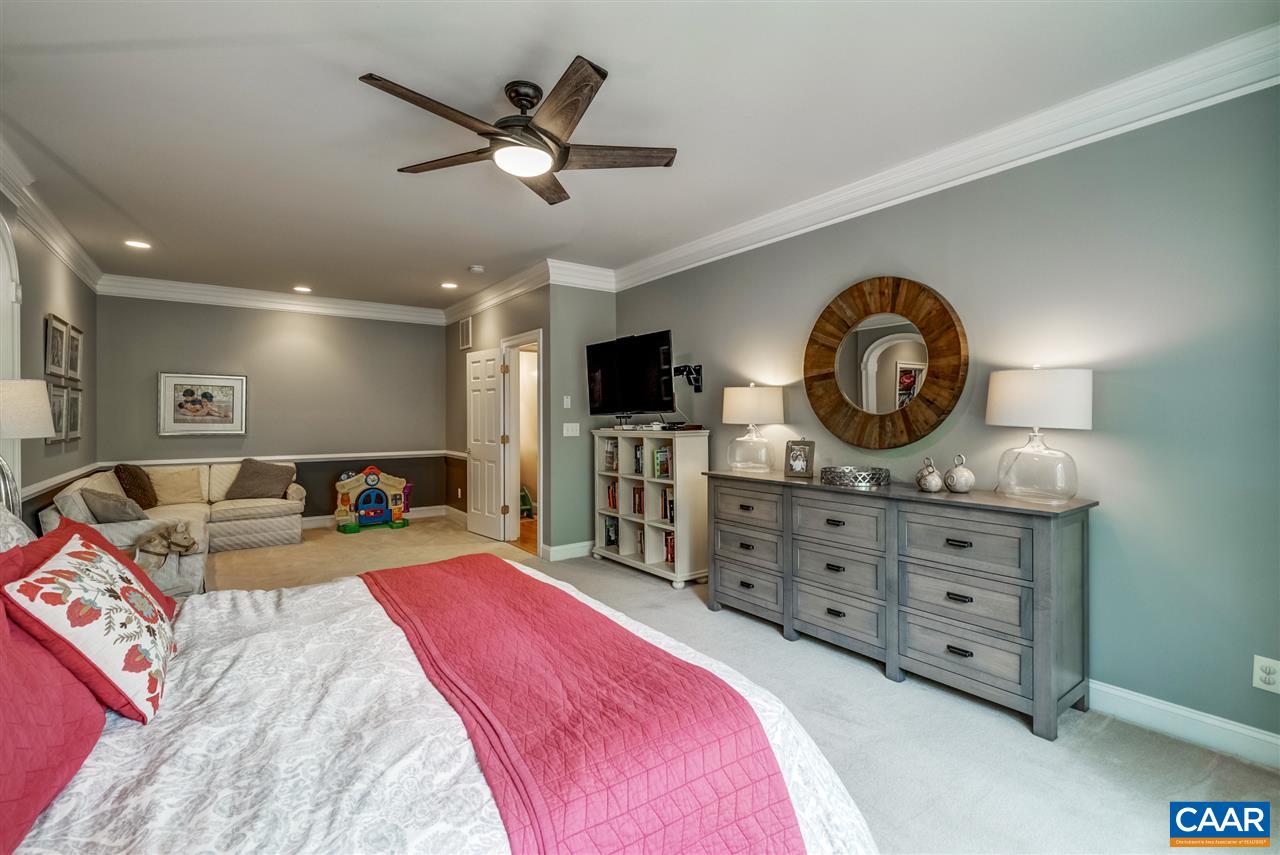 3465 Darby Road Keswick, VA 22947 - Photo 22 of 48 a bed room with a bed a television and dresser