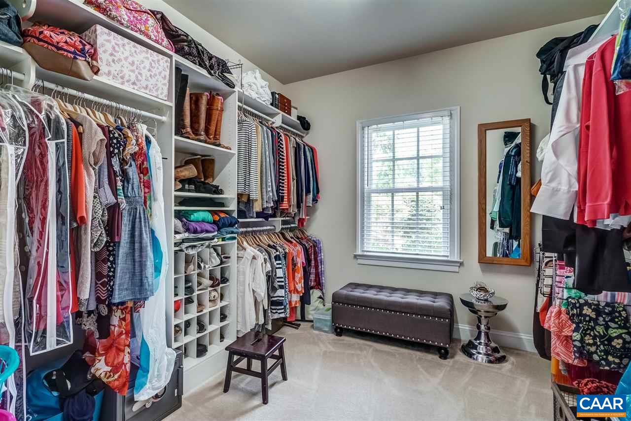3465 Darby Road Keswick, VA 22947 - Photo 24 of 48 a view of walk in closet with clothes and shoes