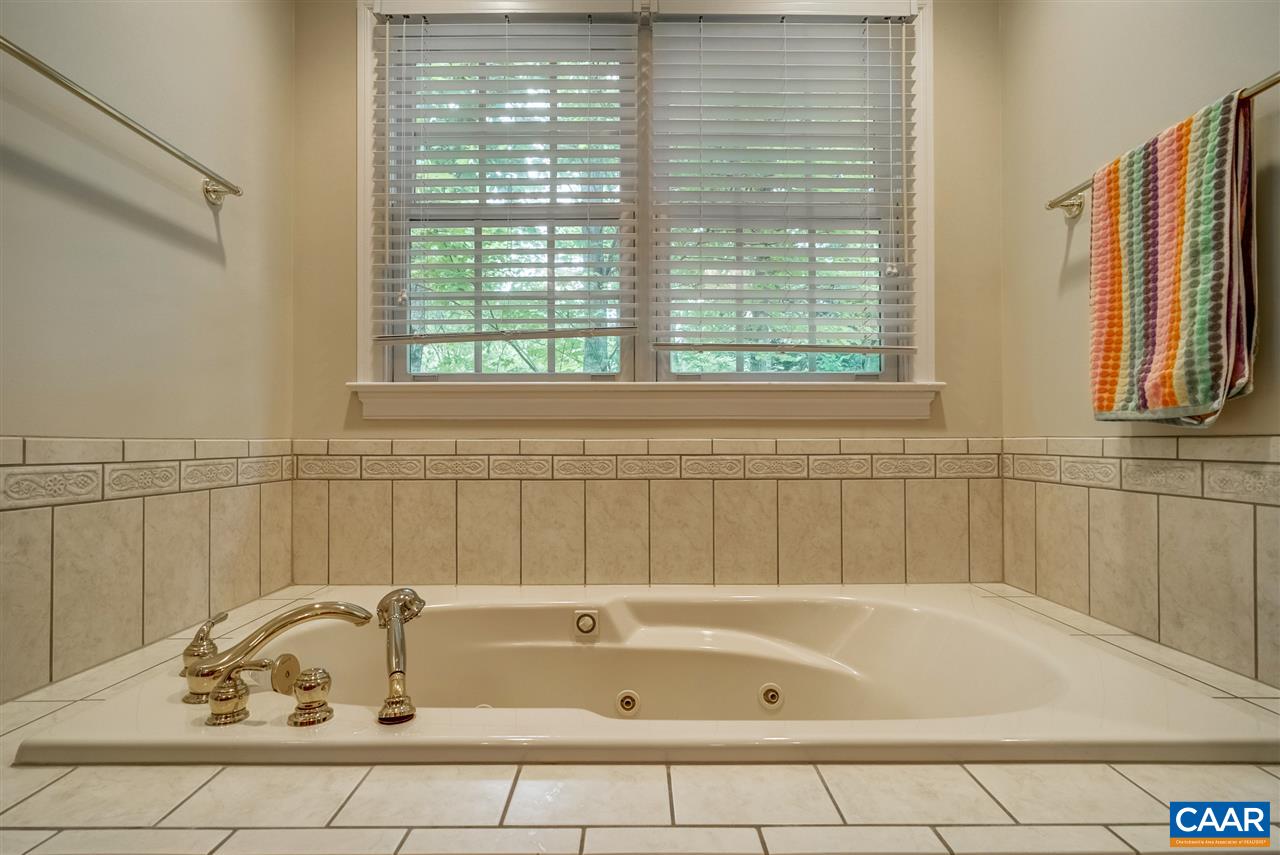 3465 Darby Road Keswick, VA 22947 - Photo 26 of 48 a bathroom with a bathtub