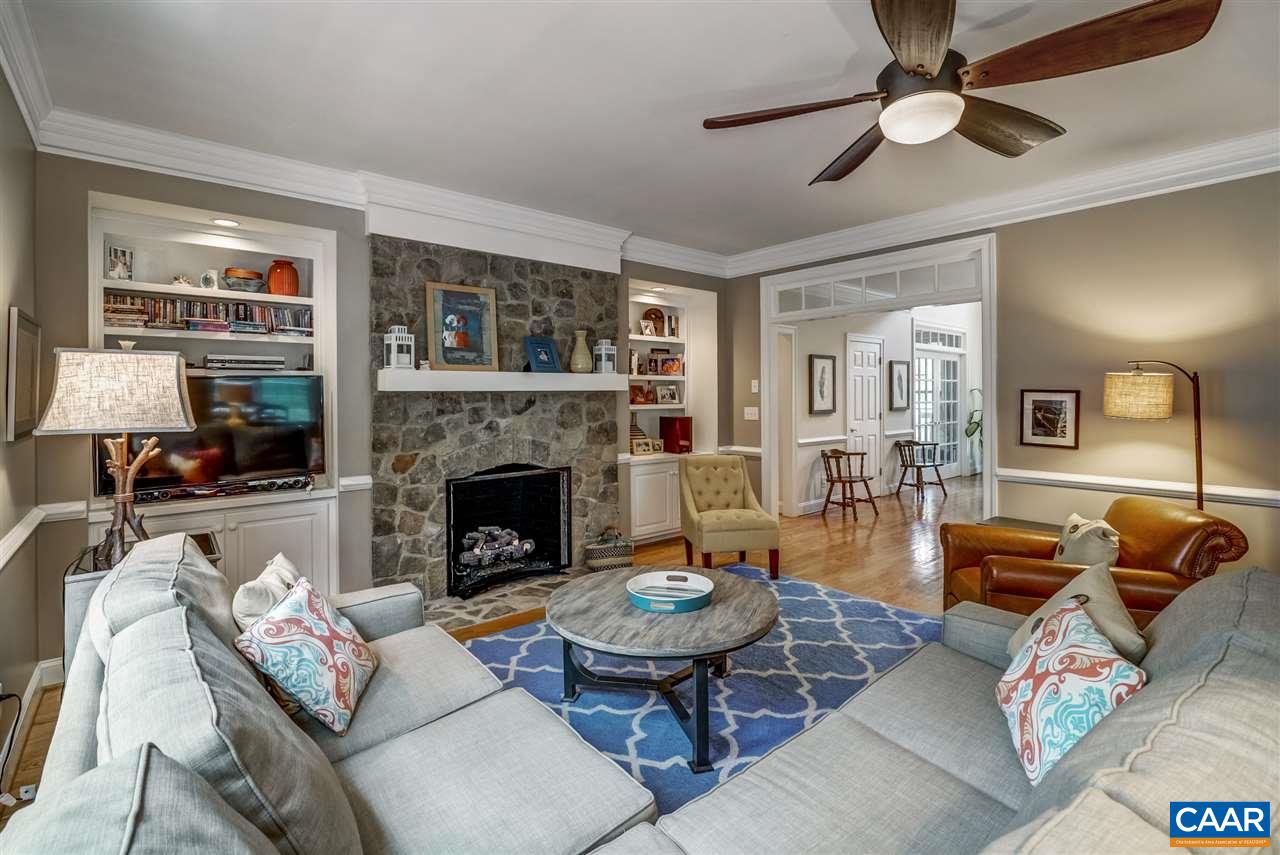 3465 Darby Road Keswick, VA 22947 - Photo 3 of 48 a living room with furniture a fireplace and a chandelier