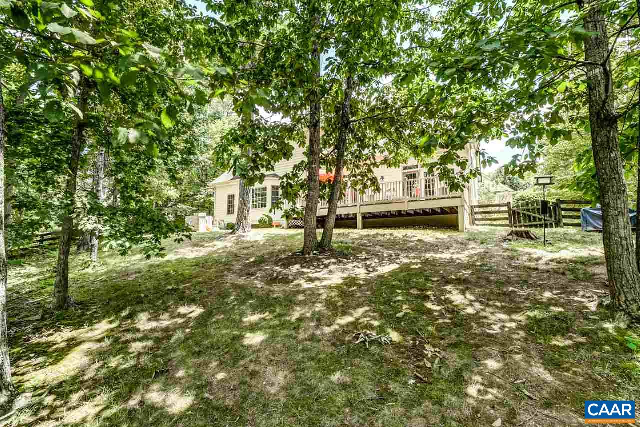 3465 Darby Road Keswick, VA 22947 - Photo 38 of 48 a bench is sitting in the middle of a yard