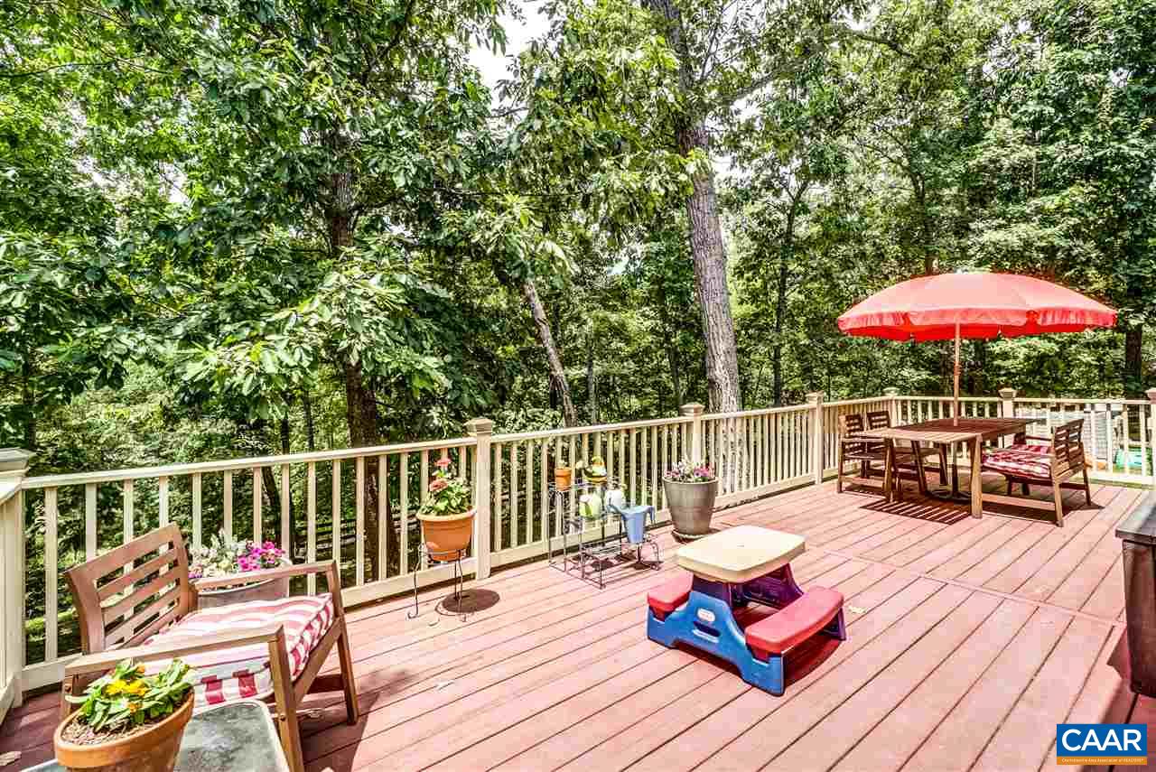 3465 Darby Road Keswick, VA 22947 - Photo 41 of 48 a view of balcony with outdoor seating and wooden floor