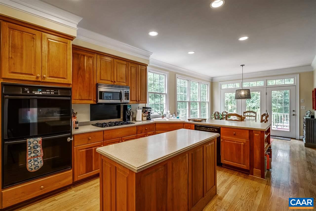 3465 Darby Road Keswick, VA 22947 - Photo 5 of 48 a kitchen with stainless steel appliances granite countertop a stove a sink and a refrigerator
