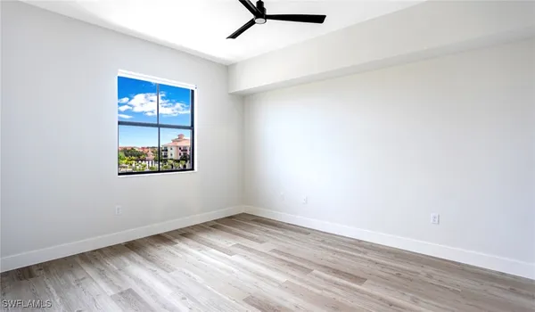 a view of hallway with wooden floor