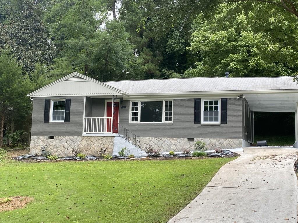 702 Farrar Court Decatur, GA 30032 - Photo 1 of 1 a front view of a house with a garden