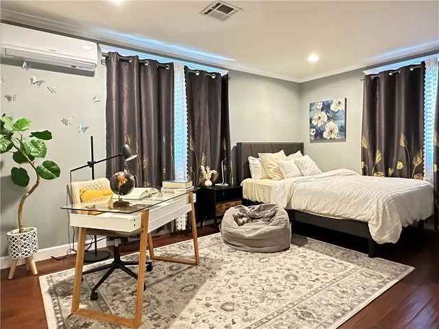 a bed room with a bed and a table