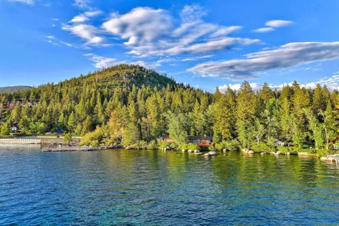 a view of a house with a yard and a garden