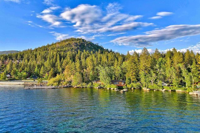 a view of a house with a yard and a garden