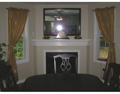 495 West Sturbridge Road East Brookfield, MA 01515 - Photo 4 of 13 a view of a livingroom with furniture and a fireplace