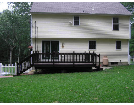 495 West Sturbridge Road East Brookfield, MA 01515 - Photo 5 of 13 a view of a house with a backyard and a garden