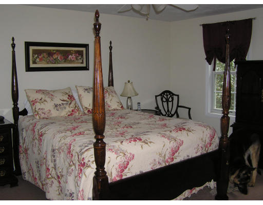 495 West Sturbridge Road East Brookfield, MA 01515 - Photo 10 of 13 a bedroom with bed and wooden floor