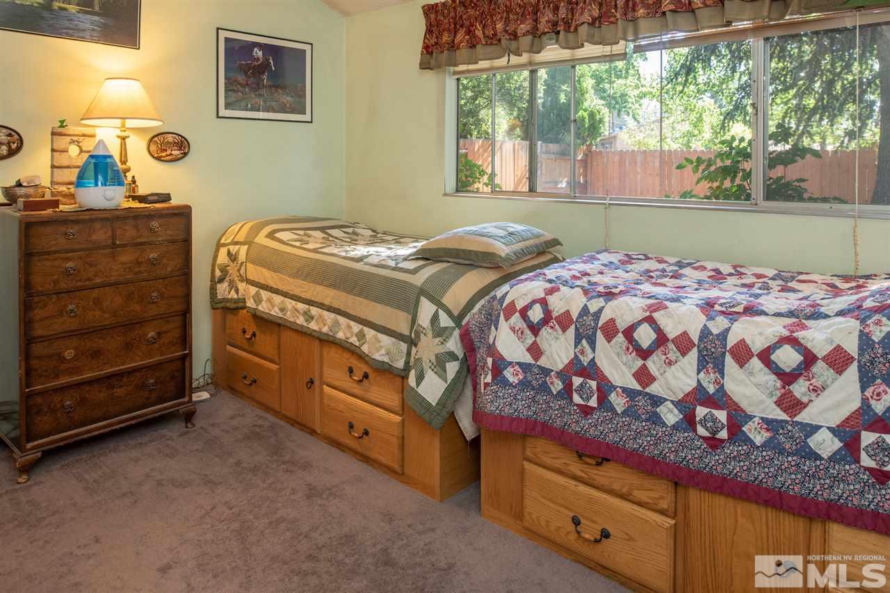 1490 O Farrell Street Reno, NV 89503 - Photo 9 of 15 a bedroom with a bed and a window