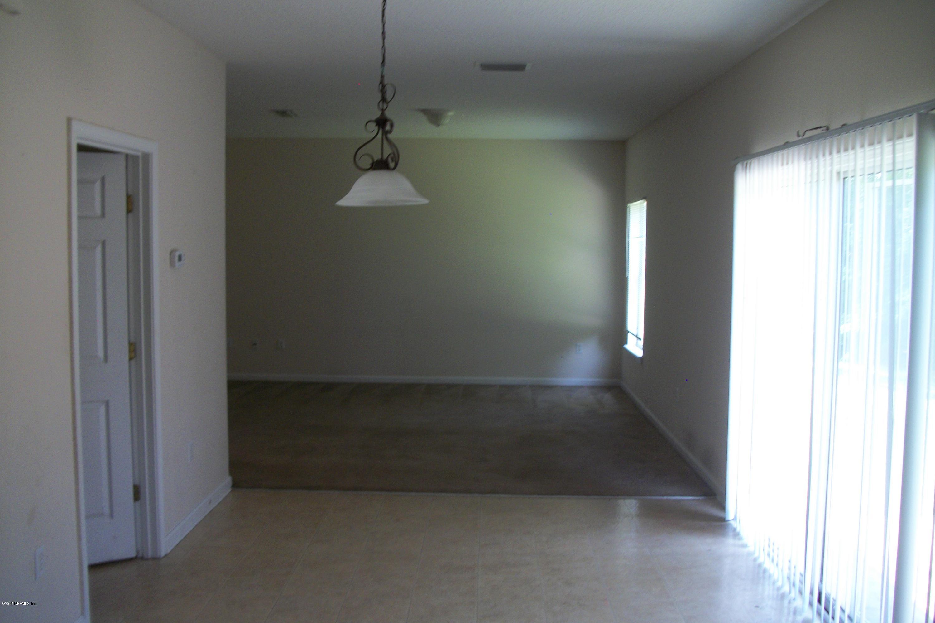 7194 Rampart Ridge Circle West Jacksonville, FL 32244 - Photo 4 of 14 a view of a room with a staircase