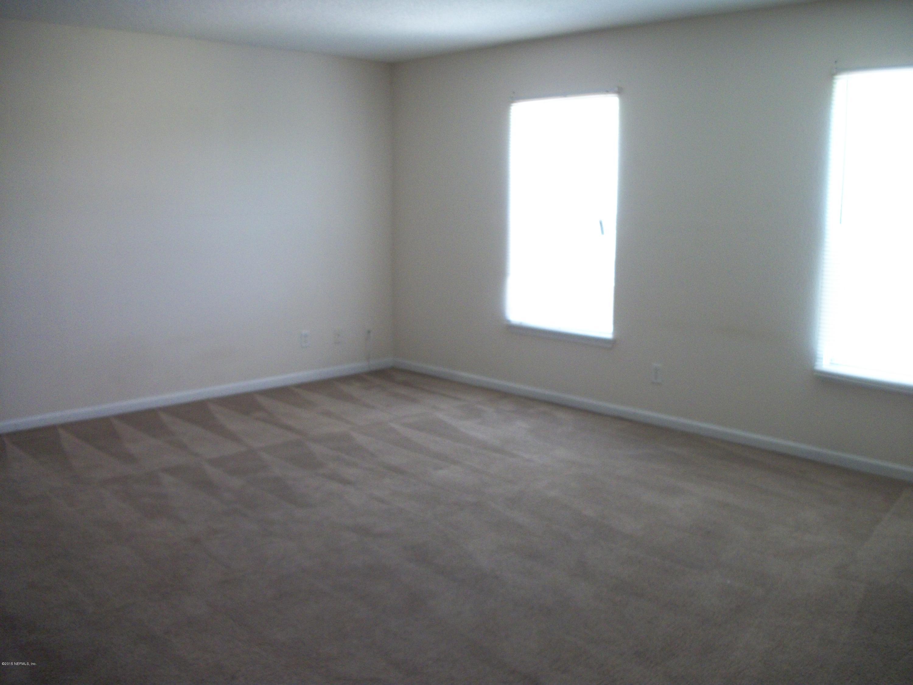 7194 Rampart Ridge Circle West Jacksonville, FL 32244 - Photo 10 of 14 an empty room with a window