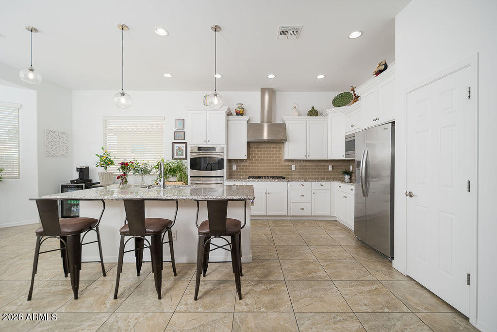 15730 West Harvard Street Goodyear, AZ 85395 - Photo 10 of 40 White Stained Cabinets with new Hardware
