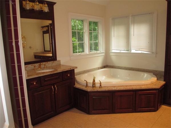 798 Worcester Street Wellesley, MA 02482 - Photo 14 of 20 a bathroom with a tub sink and mirror