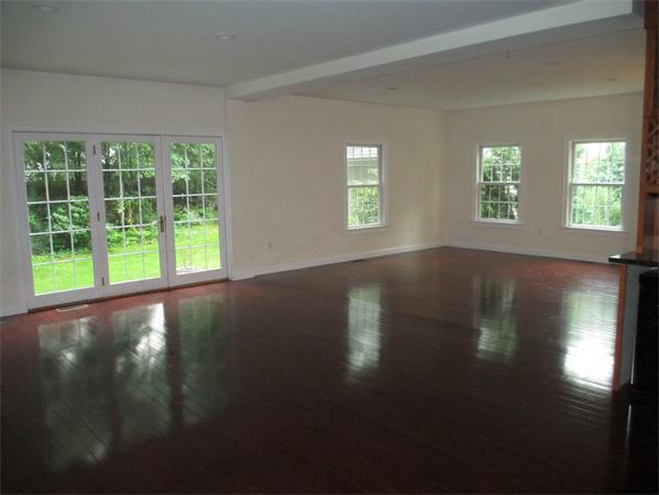 798 Worcester Street Wellesley, MA 02482 - Photo 8 of 20 a view of an empty room with wooden floor and a window