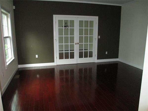 798 Worcester Street Wellesley, MA 02482 - Photo 9 of 20 a view of an empty room with wooden floor and a window