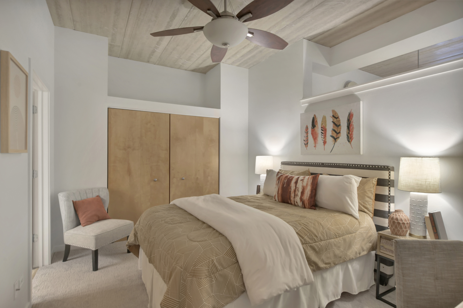 3260 North Clark Street, Unit 407 Chicago, IL 60657 - Photo 12 of 18 a bedroom with a bed and a painting on the wall